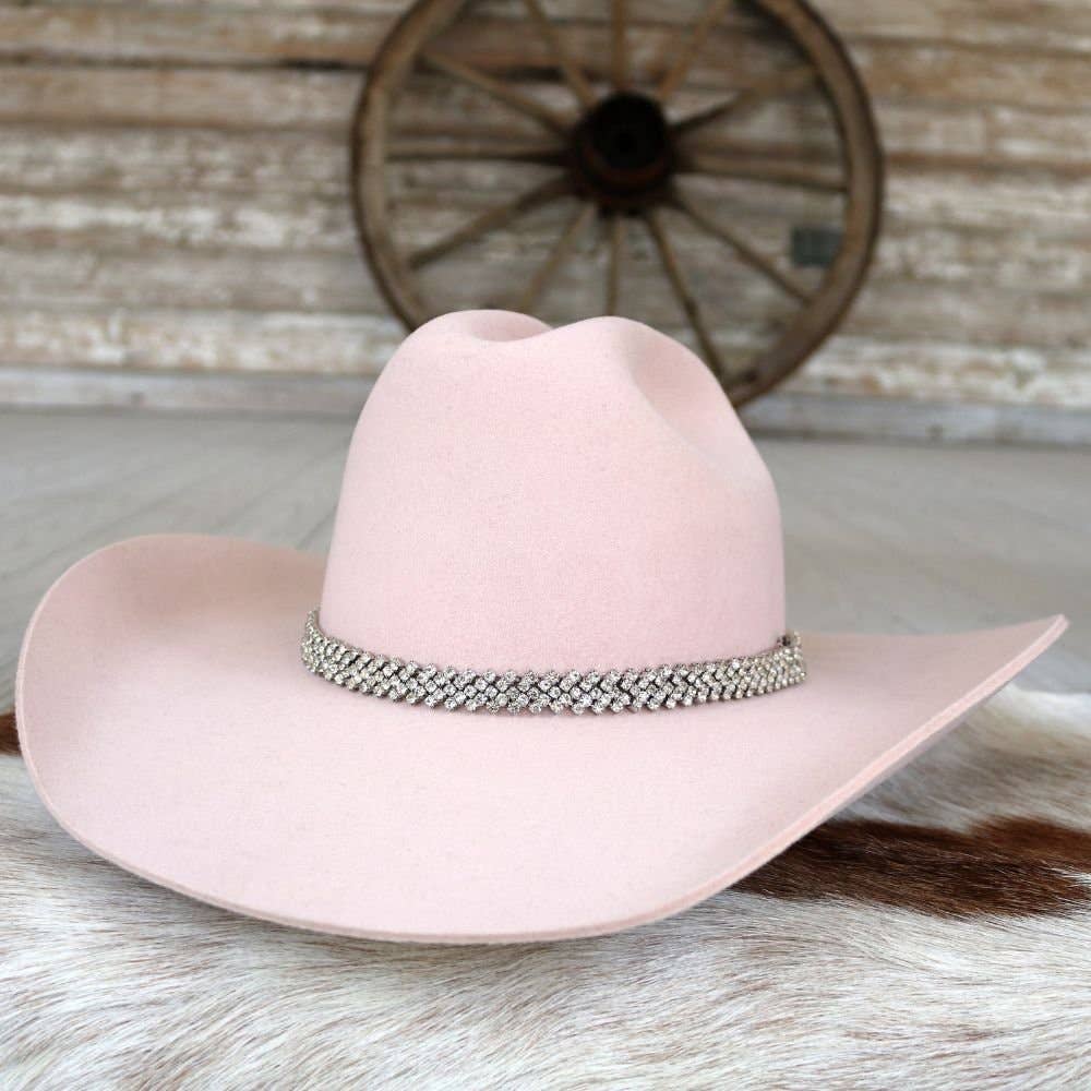Pink cowboy hat with jeweled band.