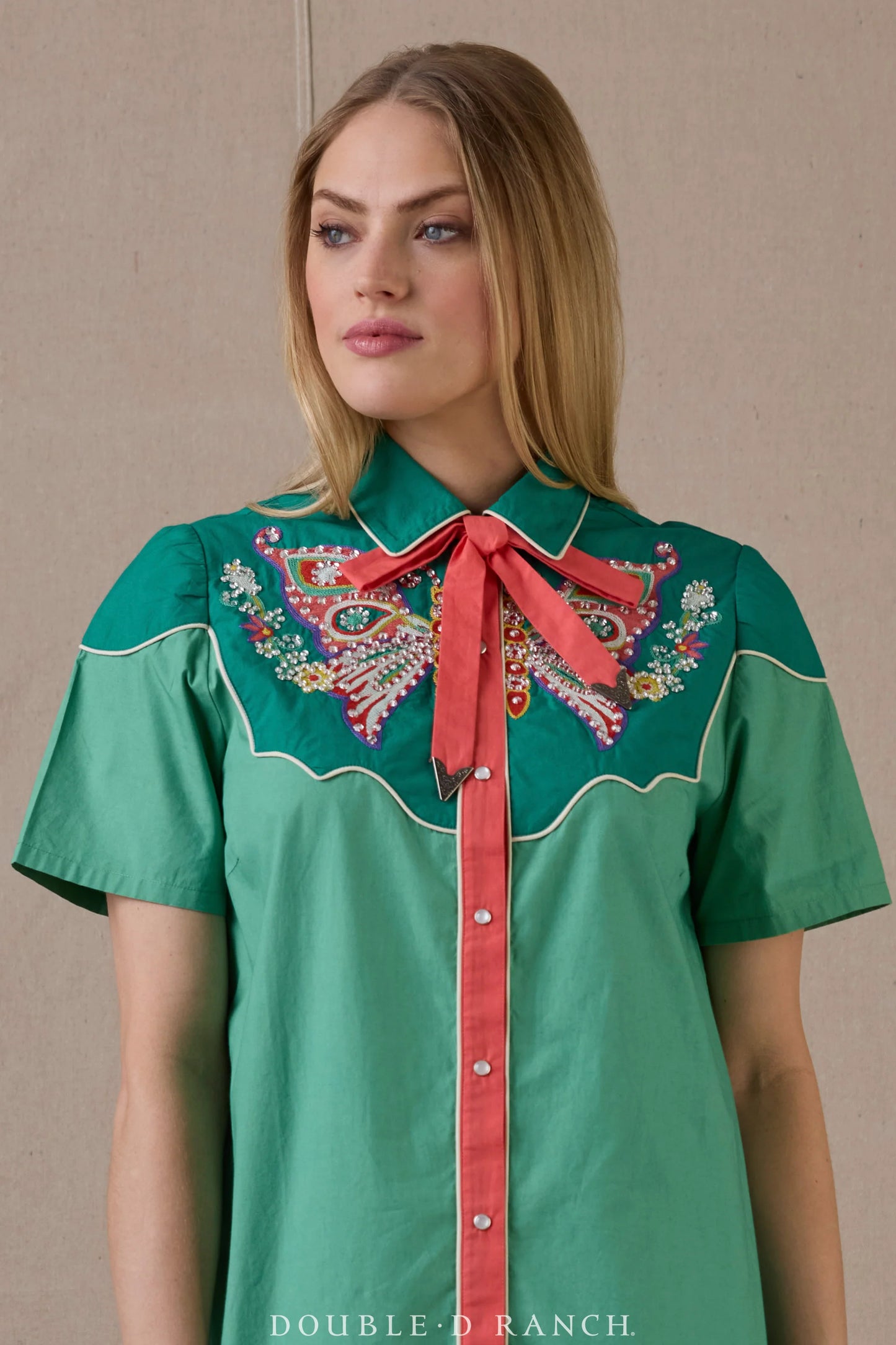 Woman in Just Wing It Dress with bow and embroidery