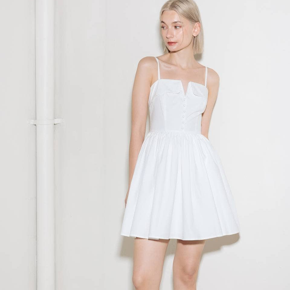 Woman wearing a white summer dress.