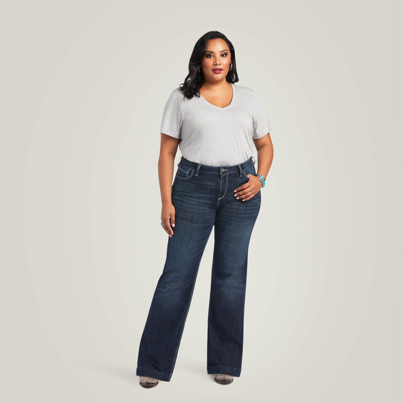 Woman in gray shirt and jeans.
