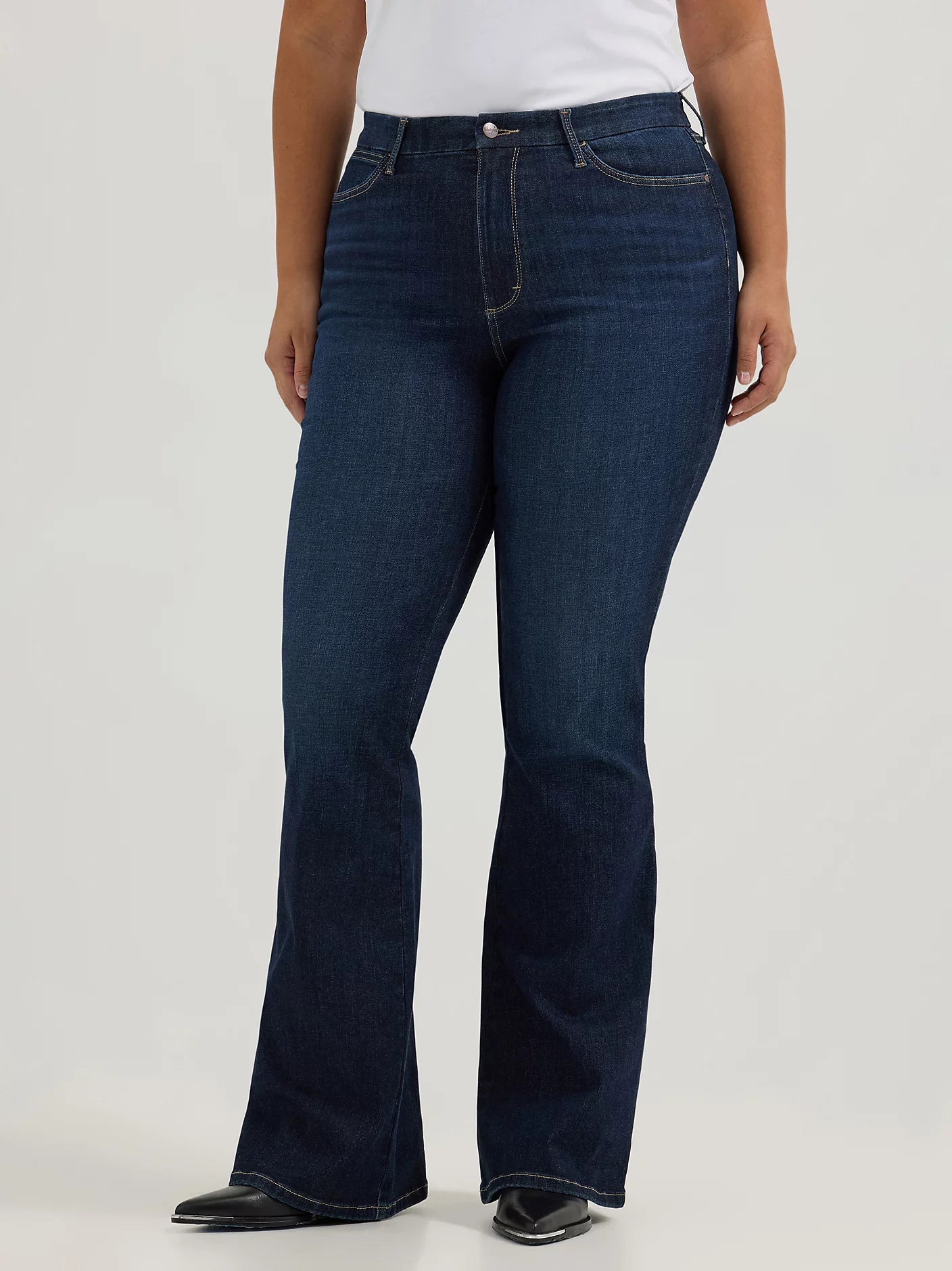 Woman wearing dark wash flare jeans.