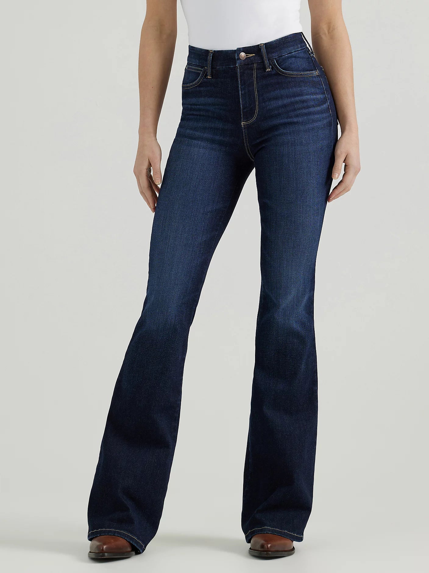 Woman wearing dark wash flare jeans.