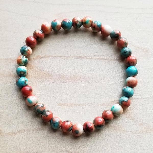 Beaded bracelet with red, blue, and white beads.