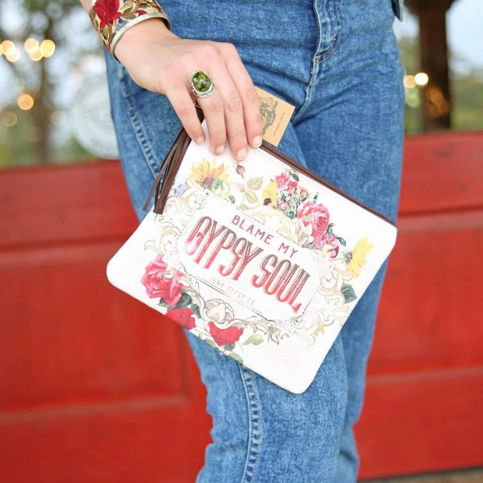 Woman holding Blame My Gypsy Soul clutch - 1wp88a5279