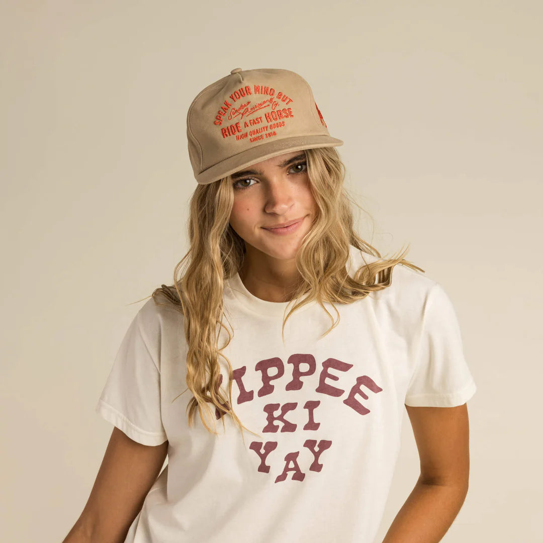 Studio model wearing Yippee Ki Yay tee and hat, FW23 collection.