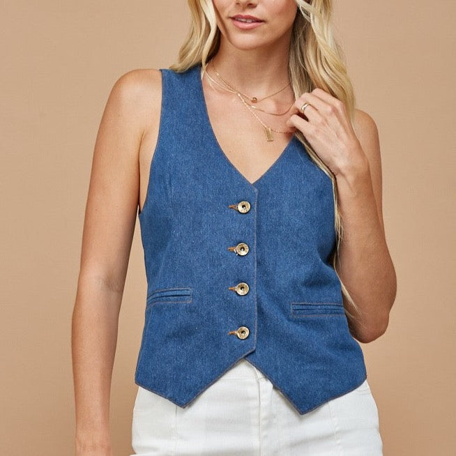 Woman wearing a blue denim vest.