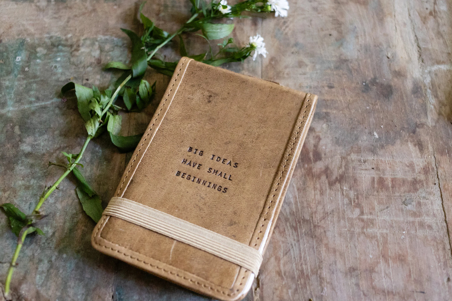 Notebook with quote Big ideas have small beginnings
