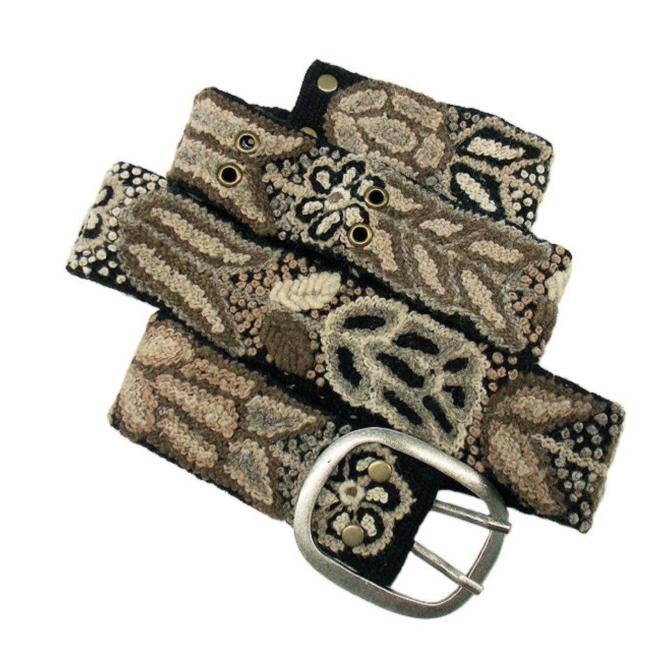 Embroidered belt with silver buckle and floral pattern.