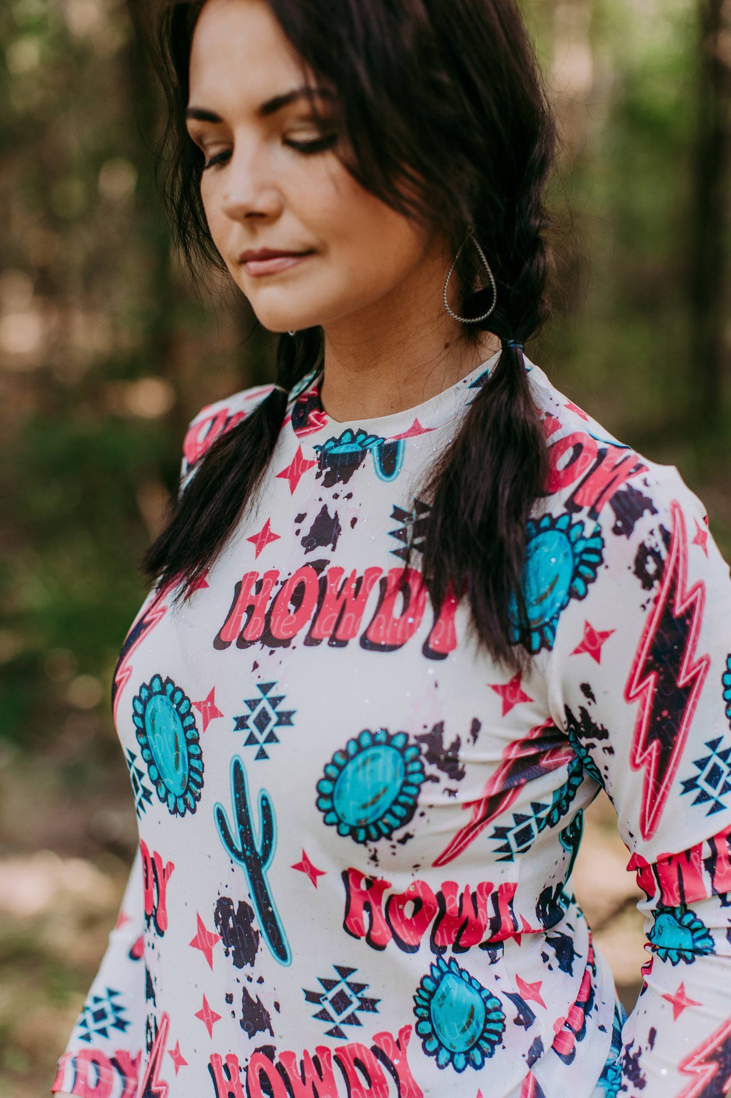Woman in Howdy patterned shirt.