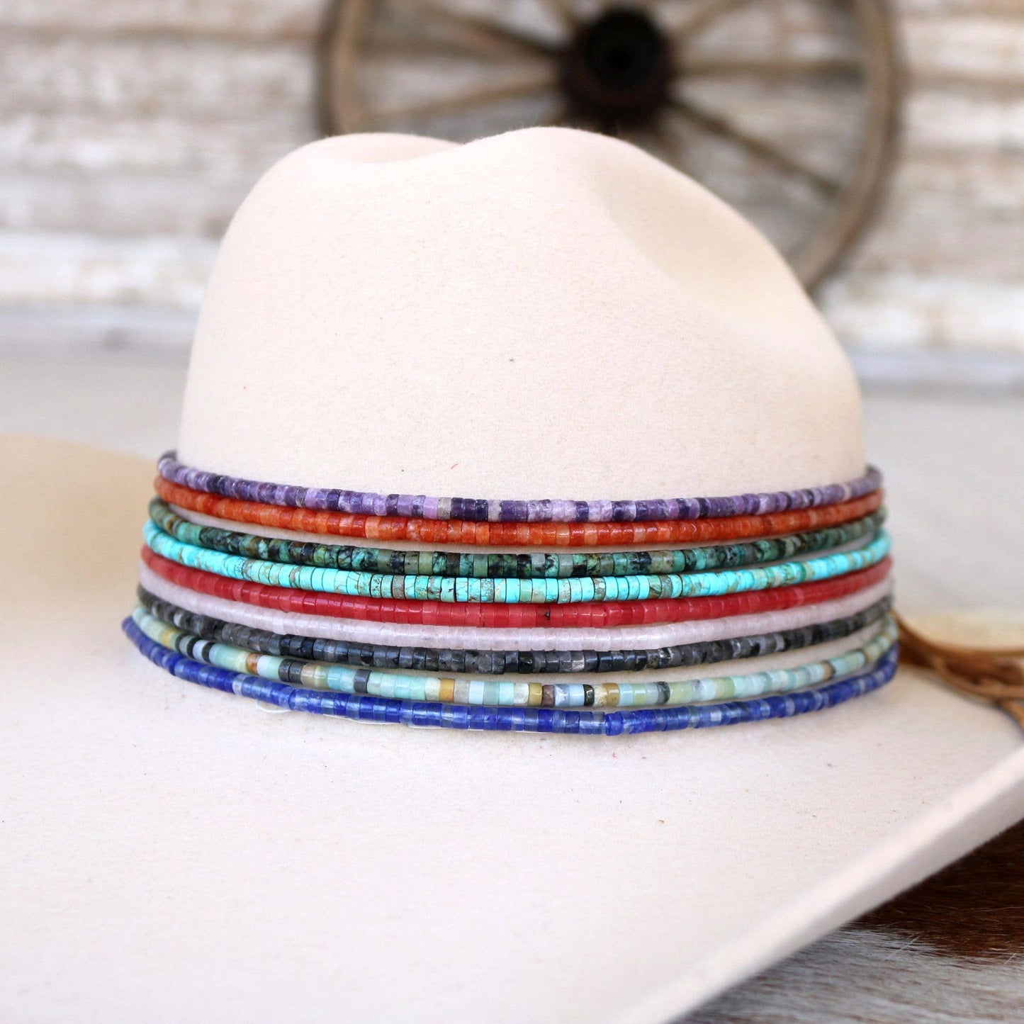 White hat with colorful beaded hatband.