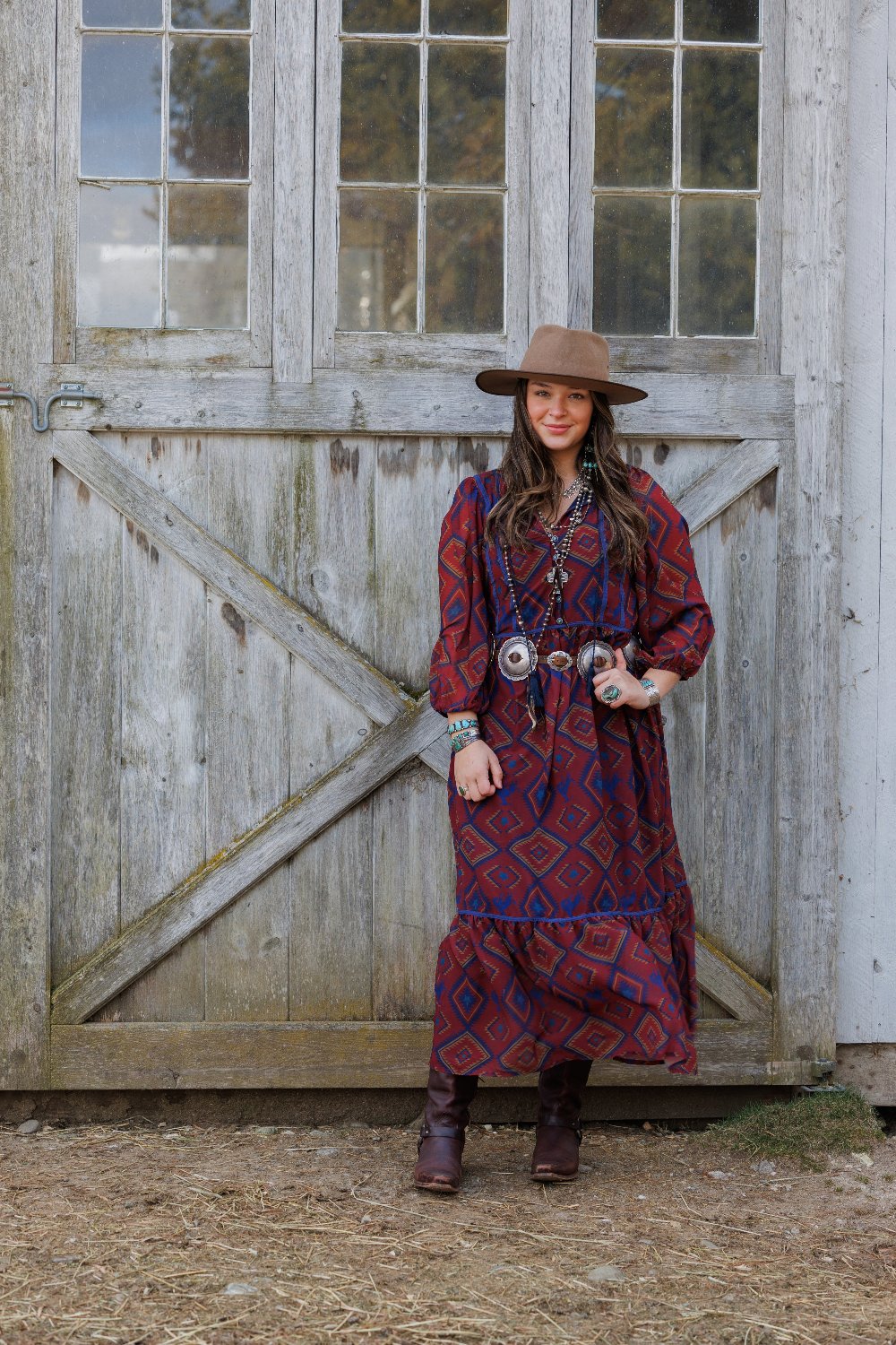 Woman in patterned dress & hat
