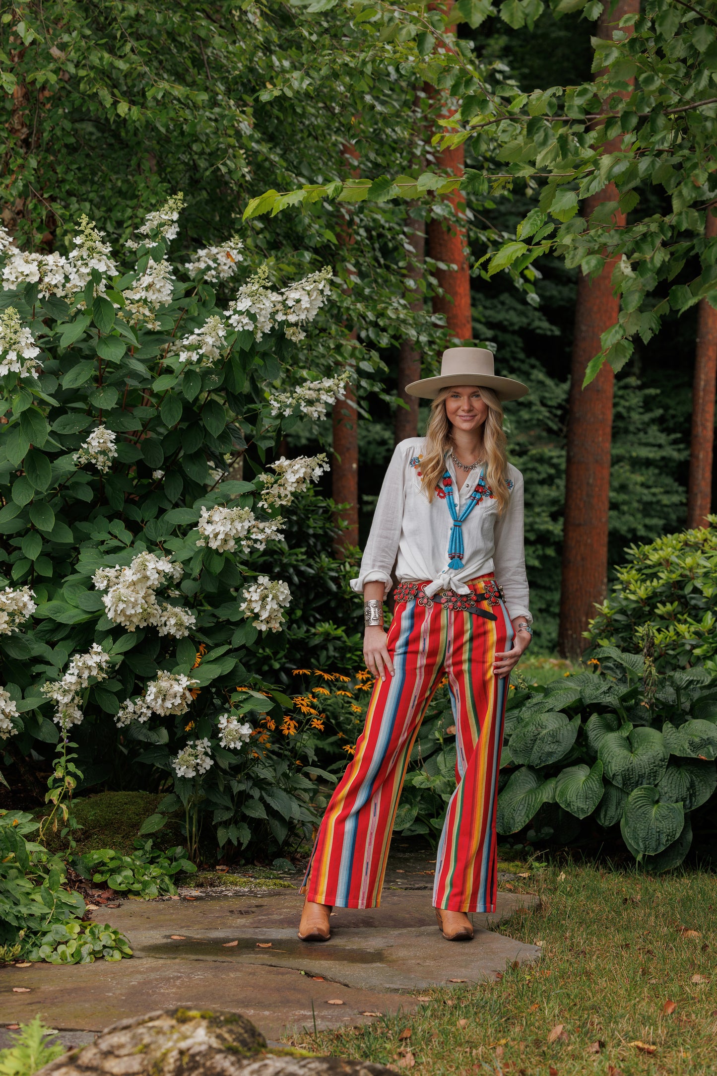 Winnie shirt and Lyla pant outfit, woman in striped pants