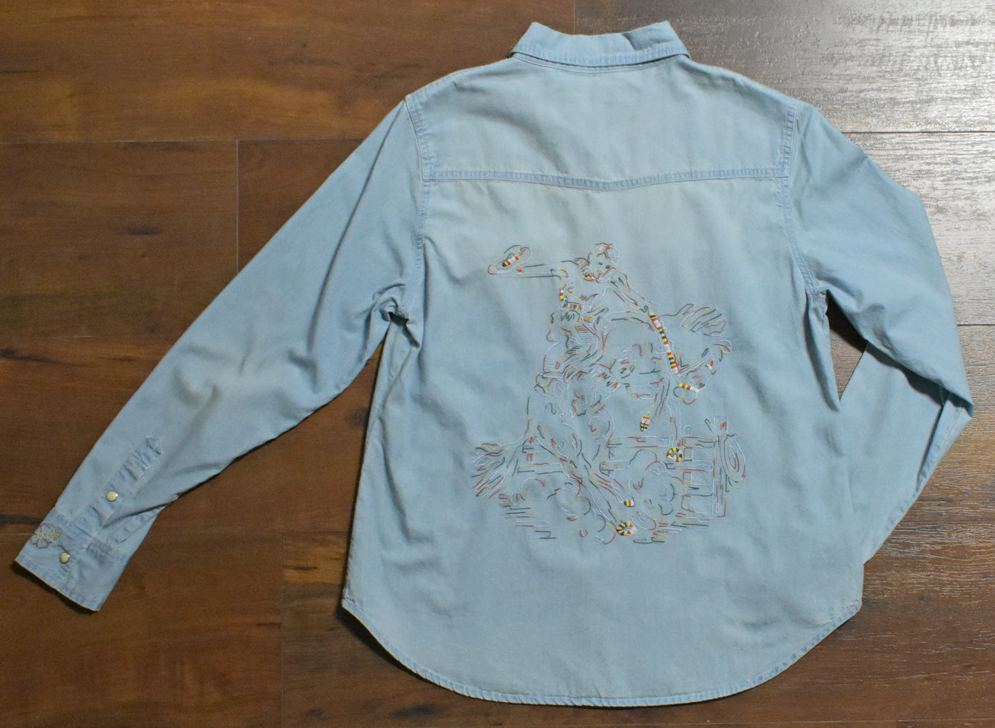 Blue denim shirt with map design on back