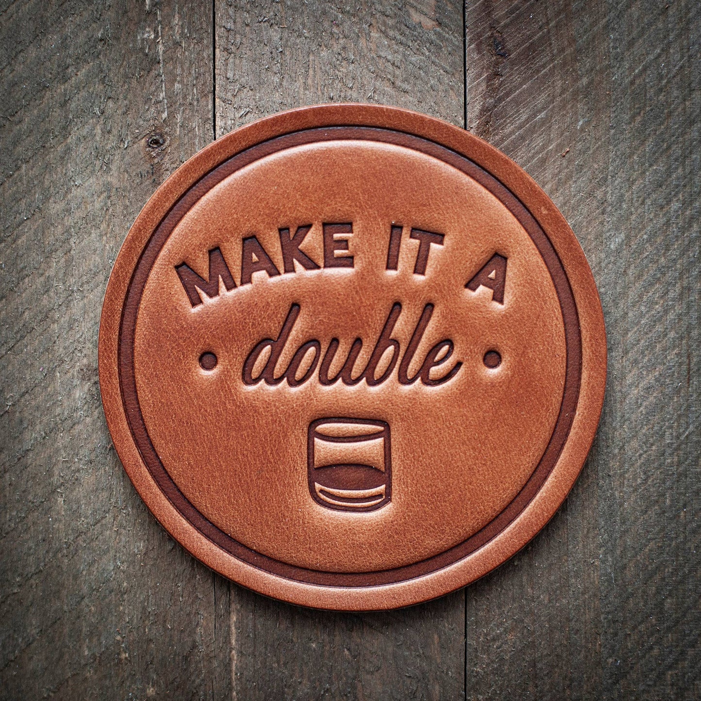 Leather coaster with Make it a double text.