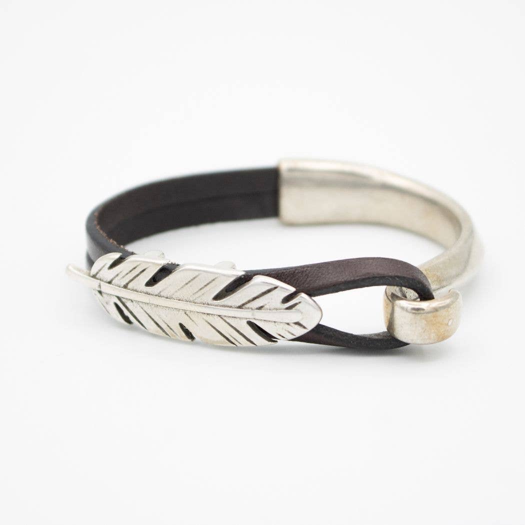 Leather bracelet with silver feather charm.