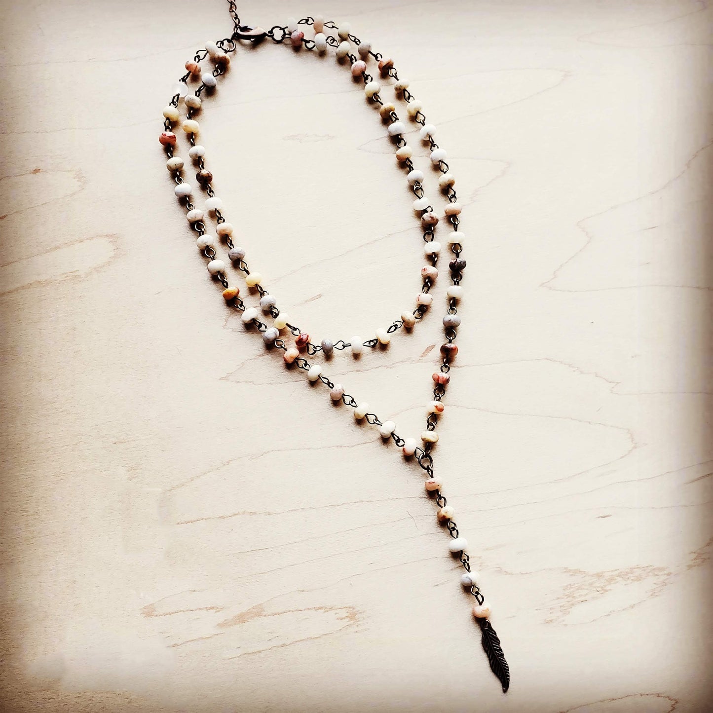 Boho layered necklace with feather charm