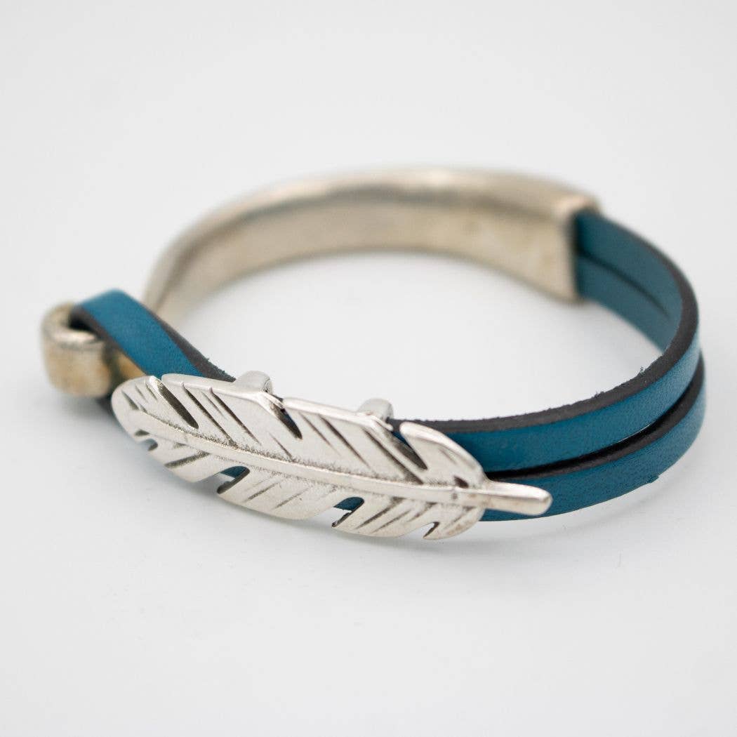 Blue leather bracelet with silver feather charm.