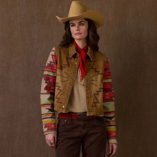 Woman wearing Sidekick Jacket, brown & patterned, with cowboy hat.
