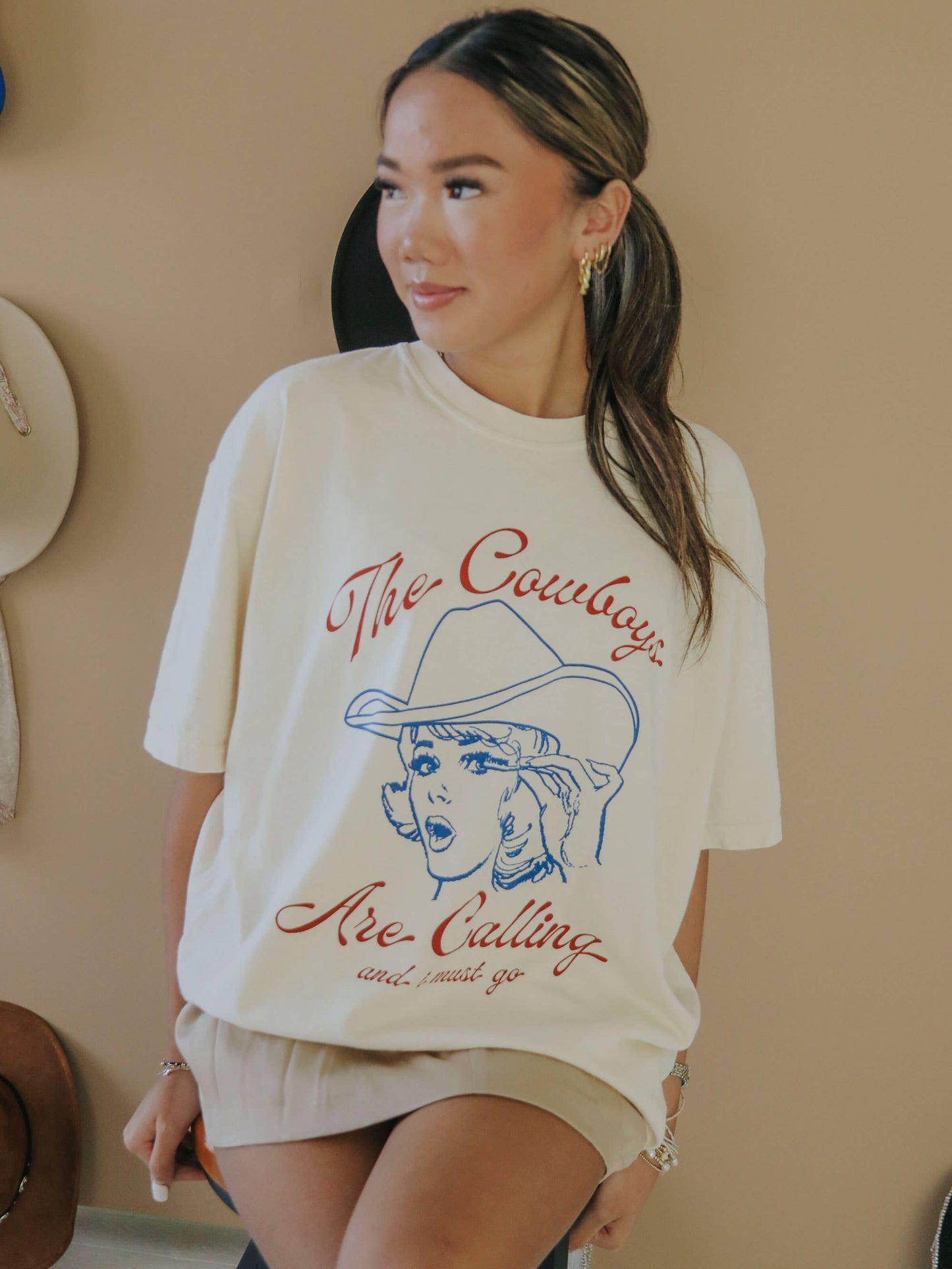 Woman wearing The Cowboys Are Calling t-shirt