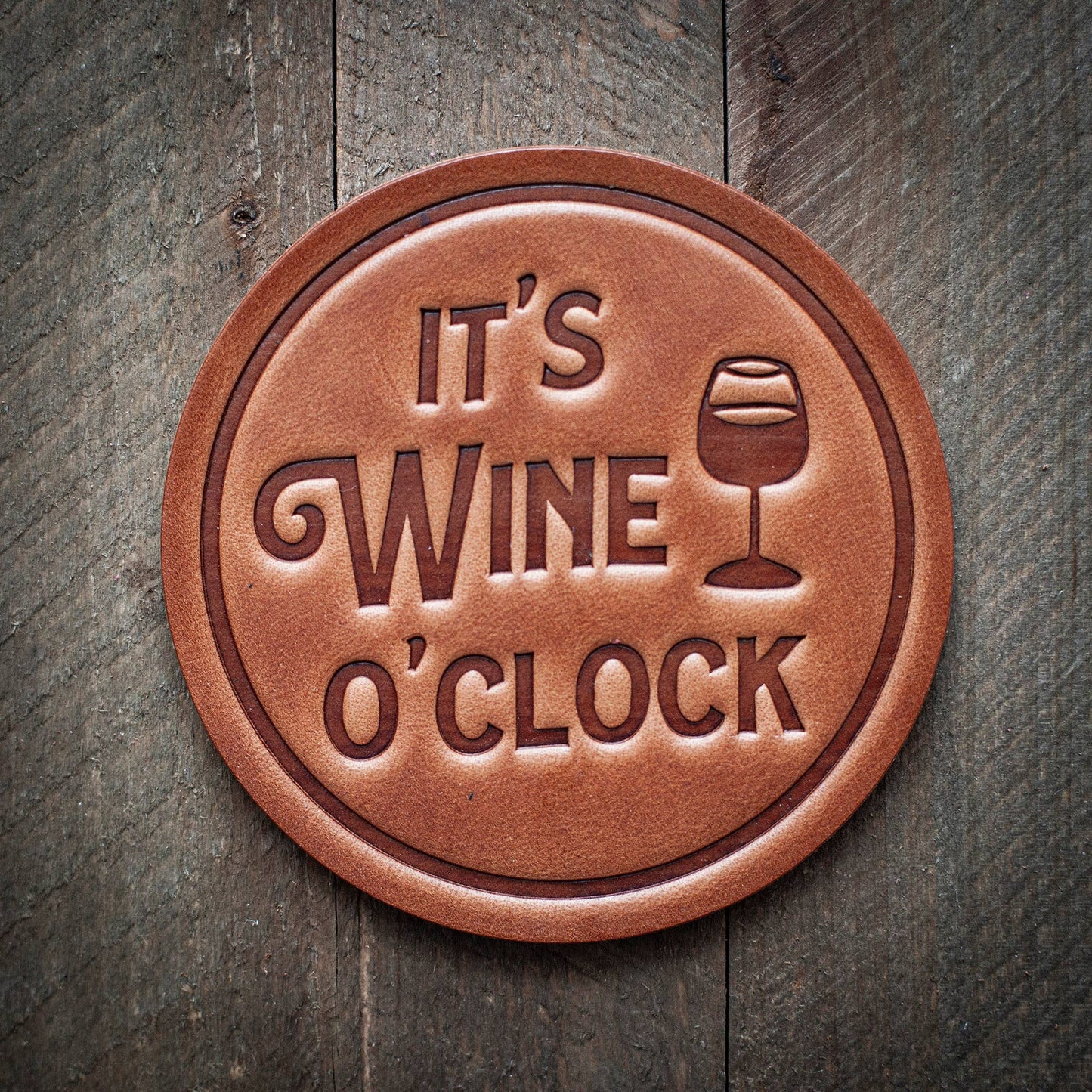 Brown leather It's Wine O'Clock coaster.