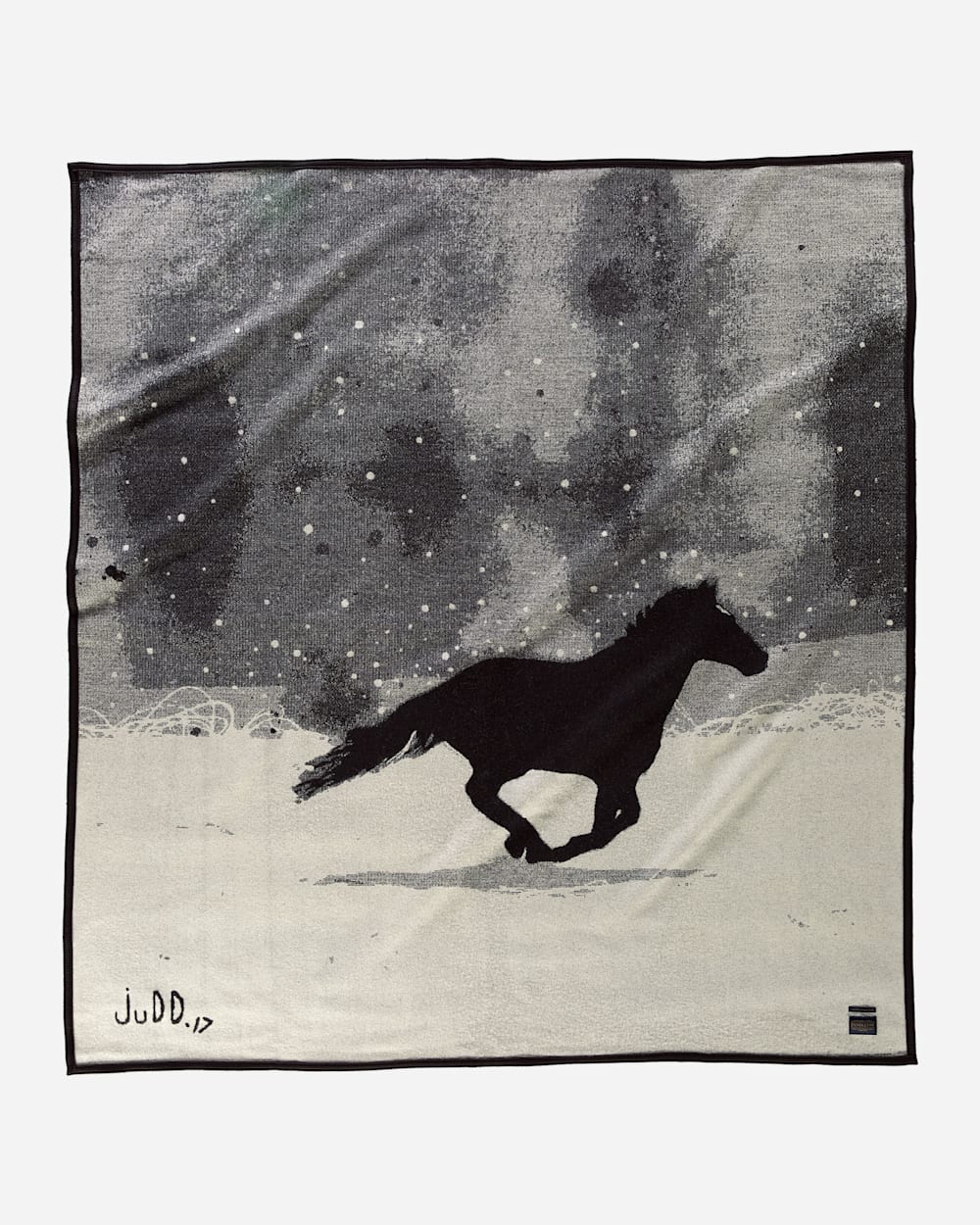 Black horse silhouette running on snowy ground.
