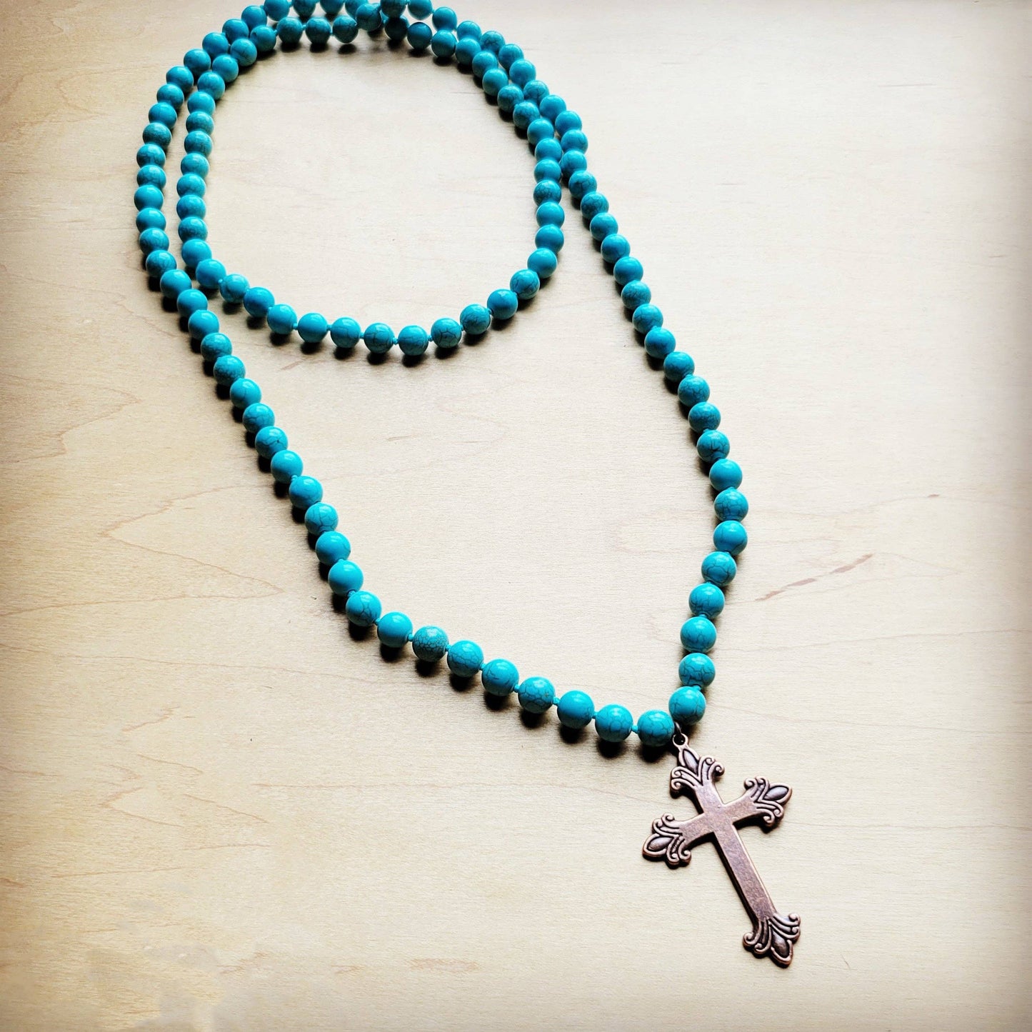 Turquoise beaded necklace with cross pendant