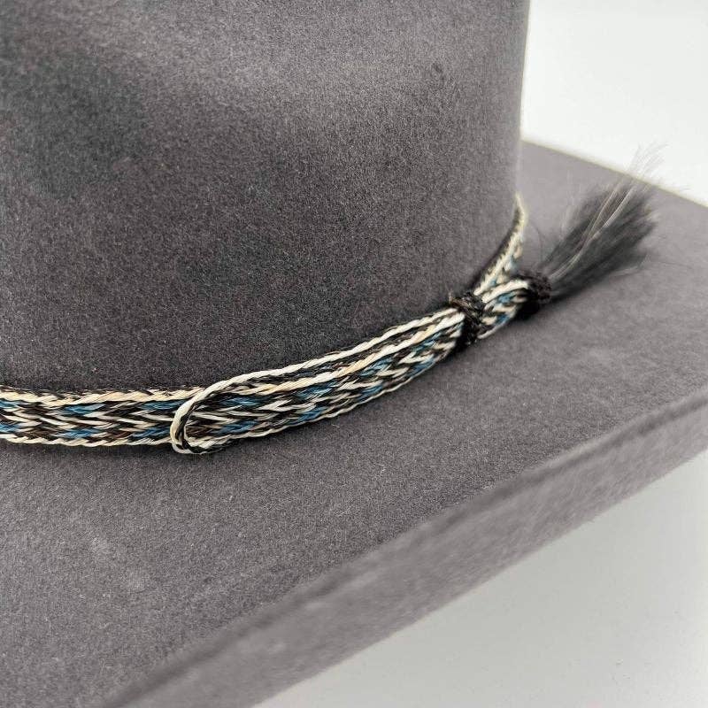 Gray hat with decorative band.
