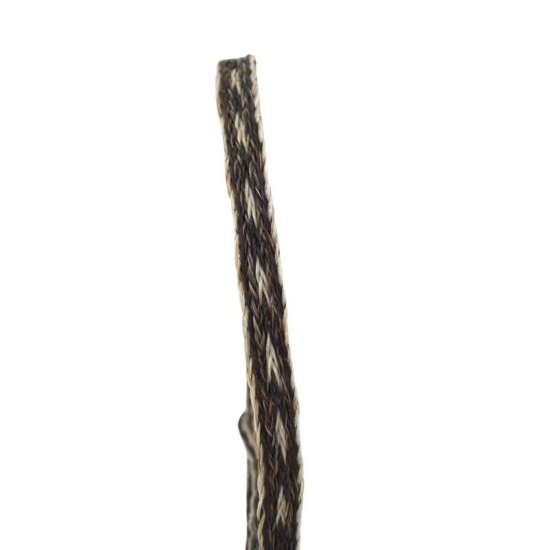 Close-up of a braided brown and white cord.