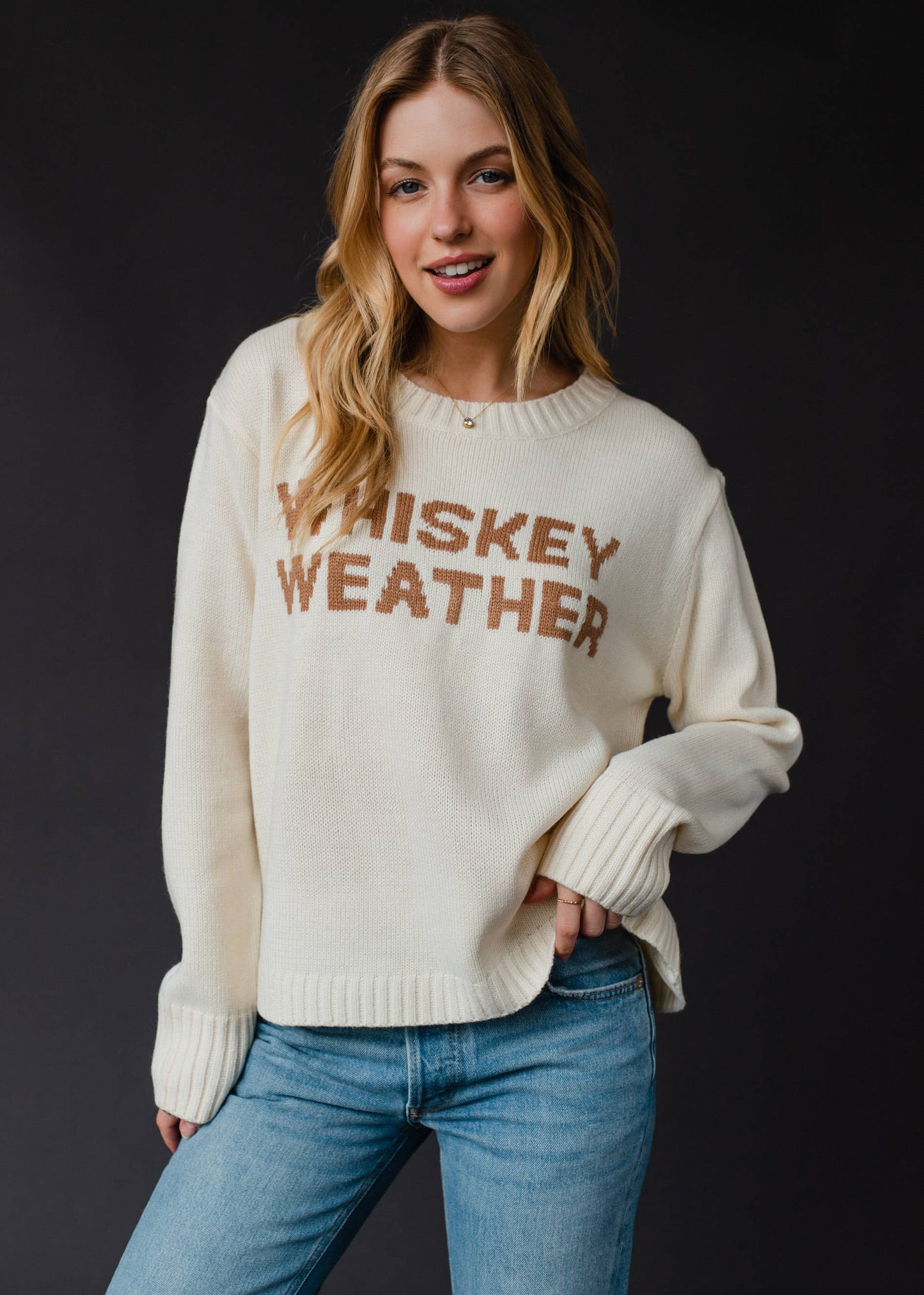 Woman in Whiskey Weather sweater.