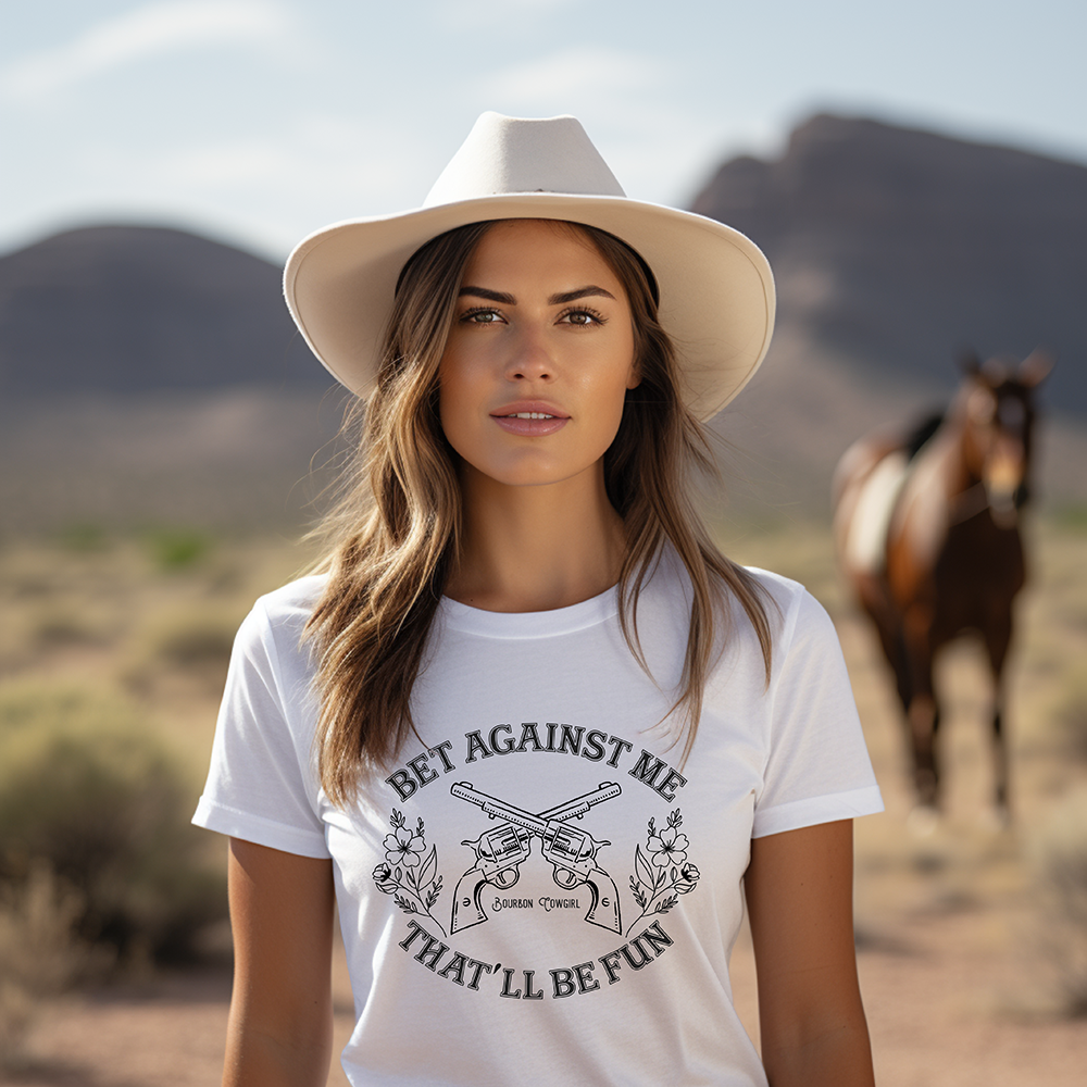 Woman in hat with Bet Against Me shirt, horse.