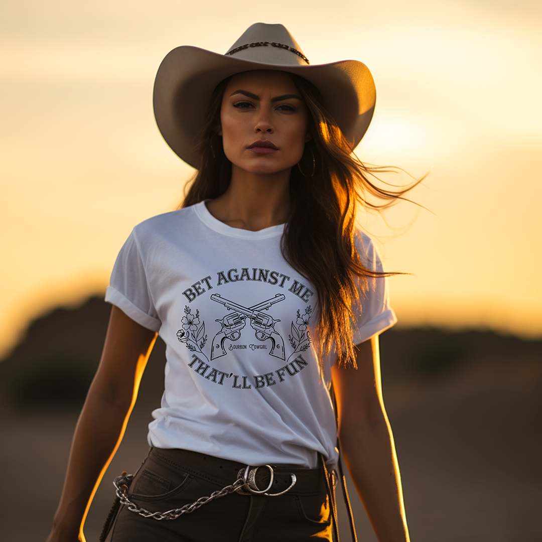 Woman in cowboy hat and Bet Against Me tee