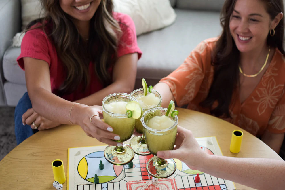 Women toasting margaritas at game night