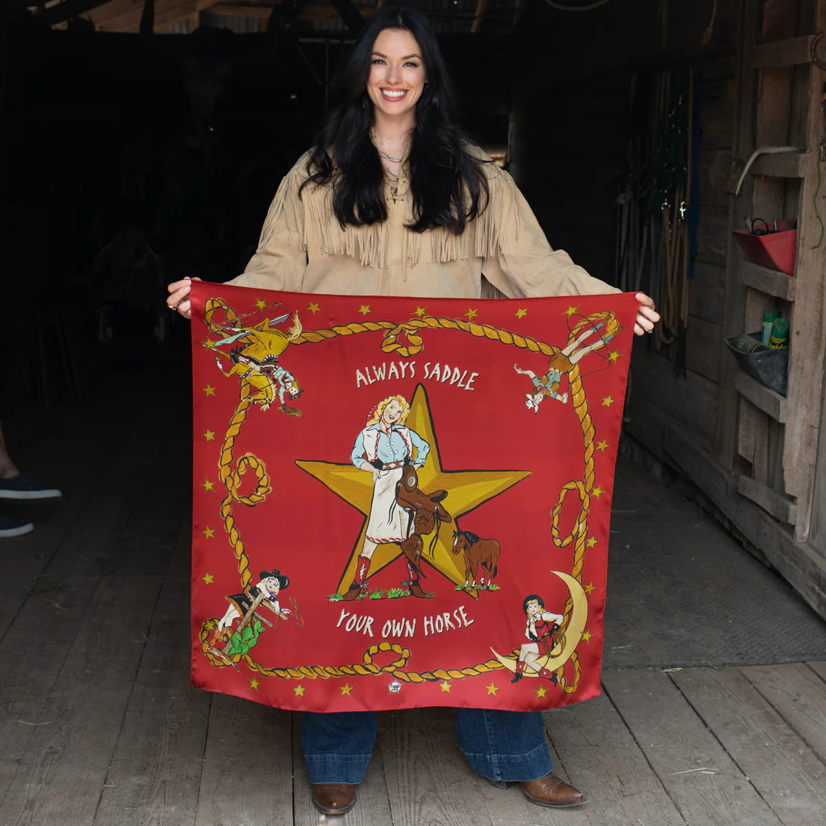 Woman holding red Always Saddle Your Own Horse scarf