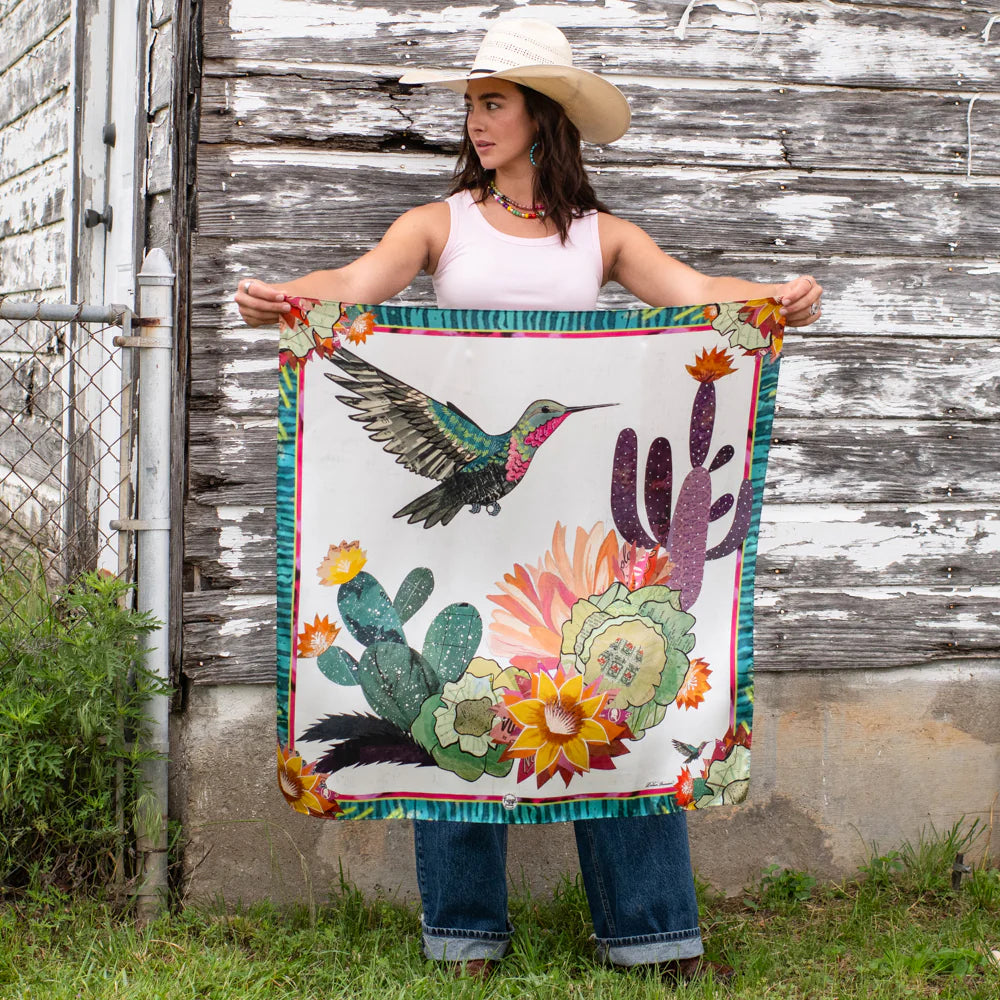 Woman holding a hummingbird & cactus scarf