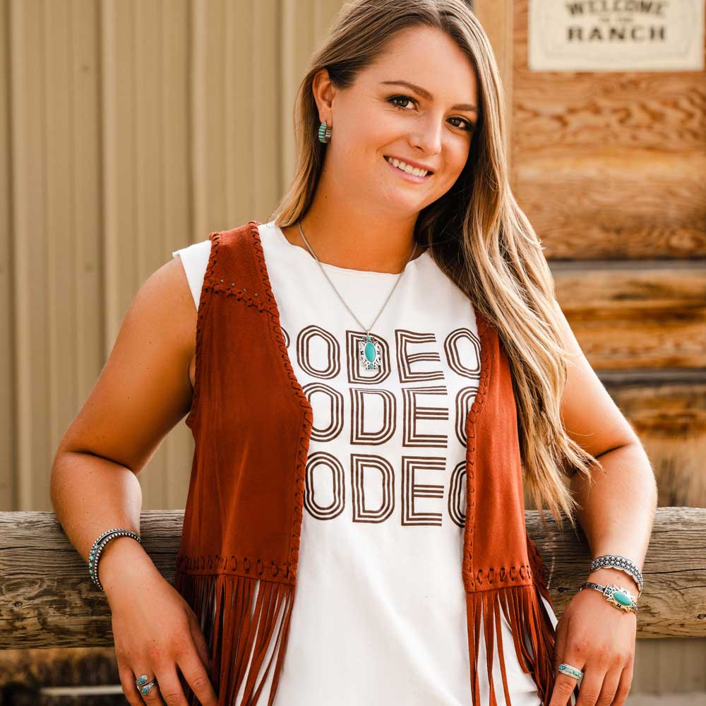 Woman in rodeo shirt and vest