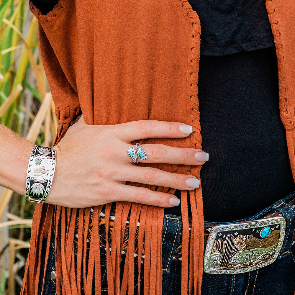 Woman's hand with turquoise ring & bracelet
