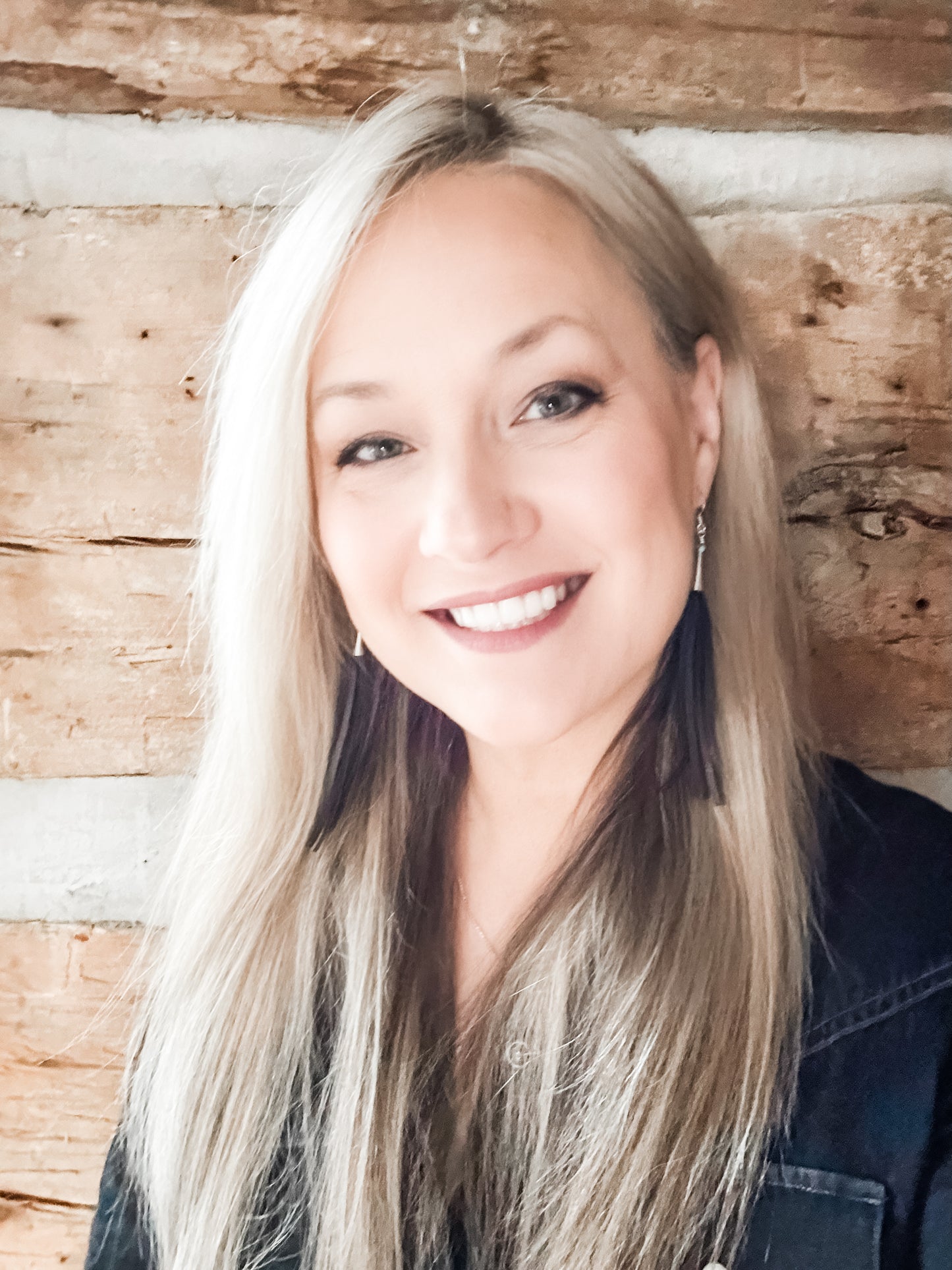 Smiling woman with long blonde hair, Facetune photo from Jan 2, 2024