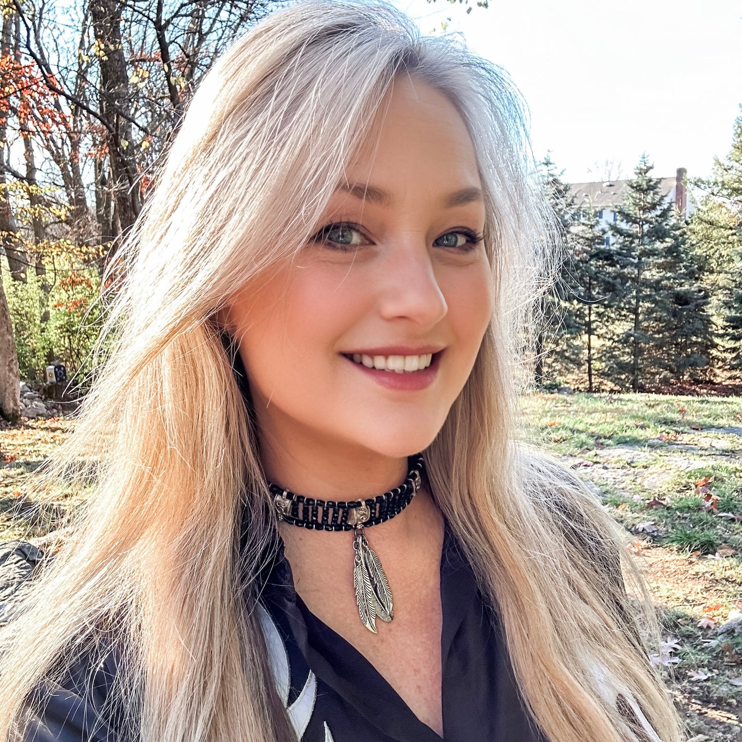 Woman with blonde hair and choker necklace