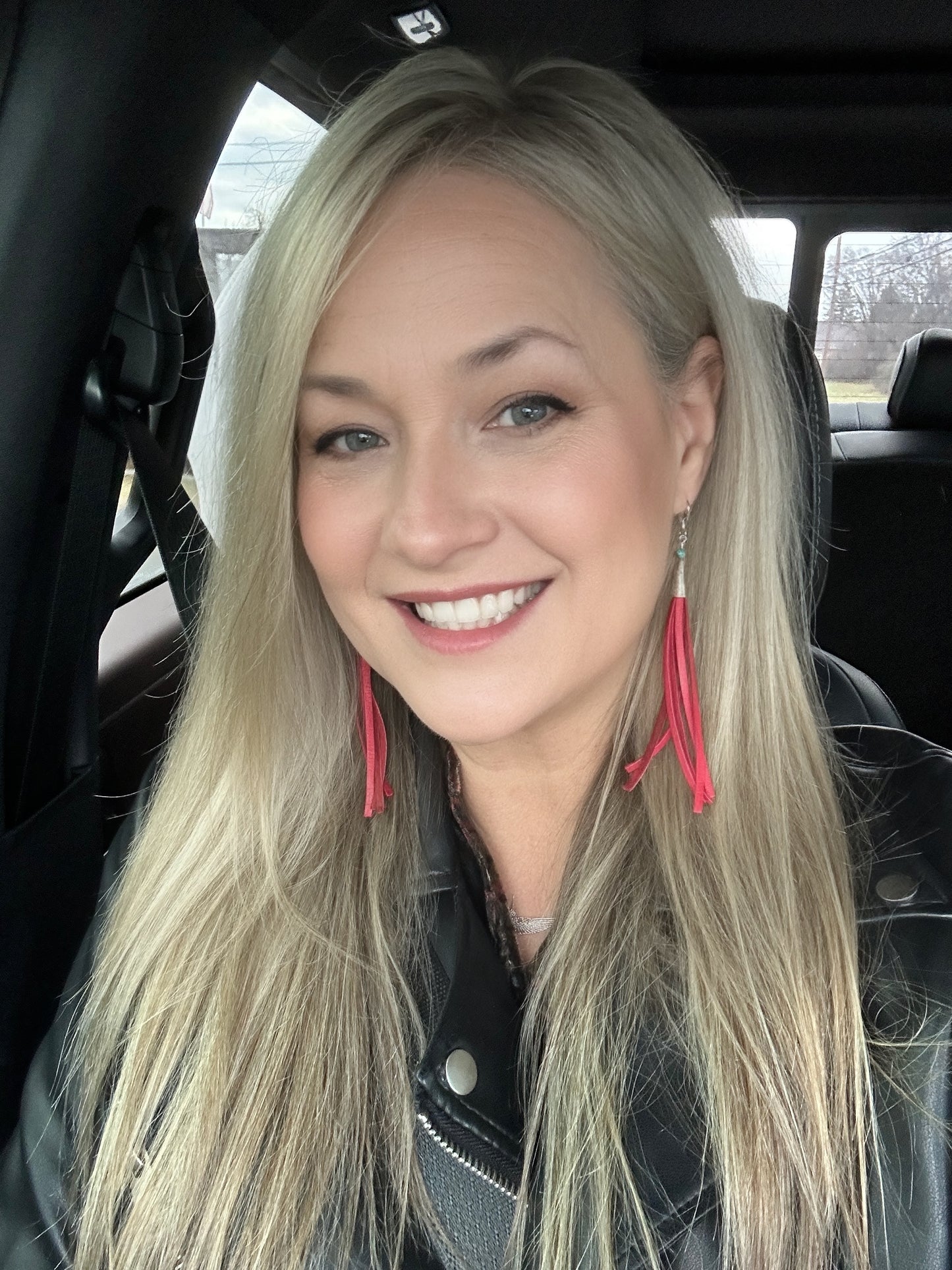 Smiling woman with blonde hair, Facetune photo from Dec 31, 2023.