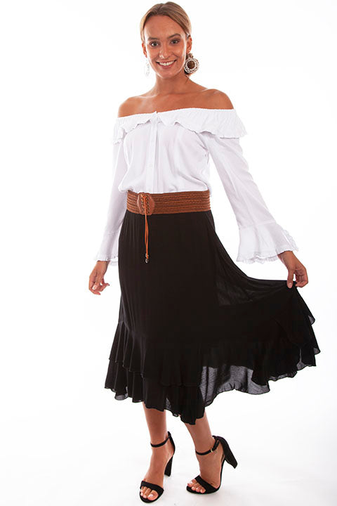 Woman in white top, black skirt, and sandals
