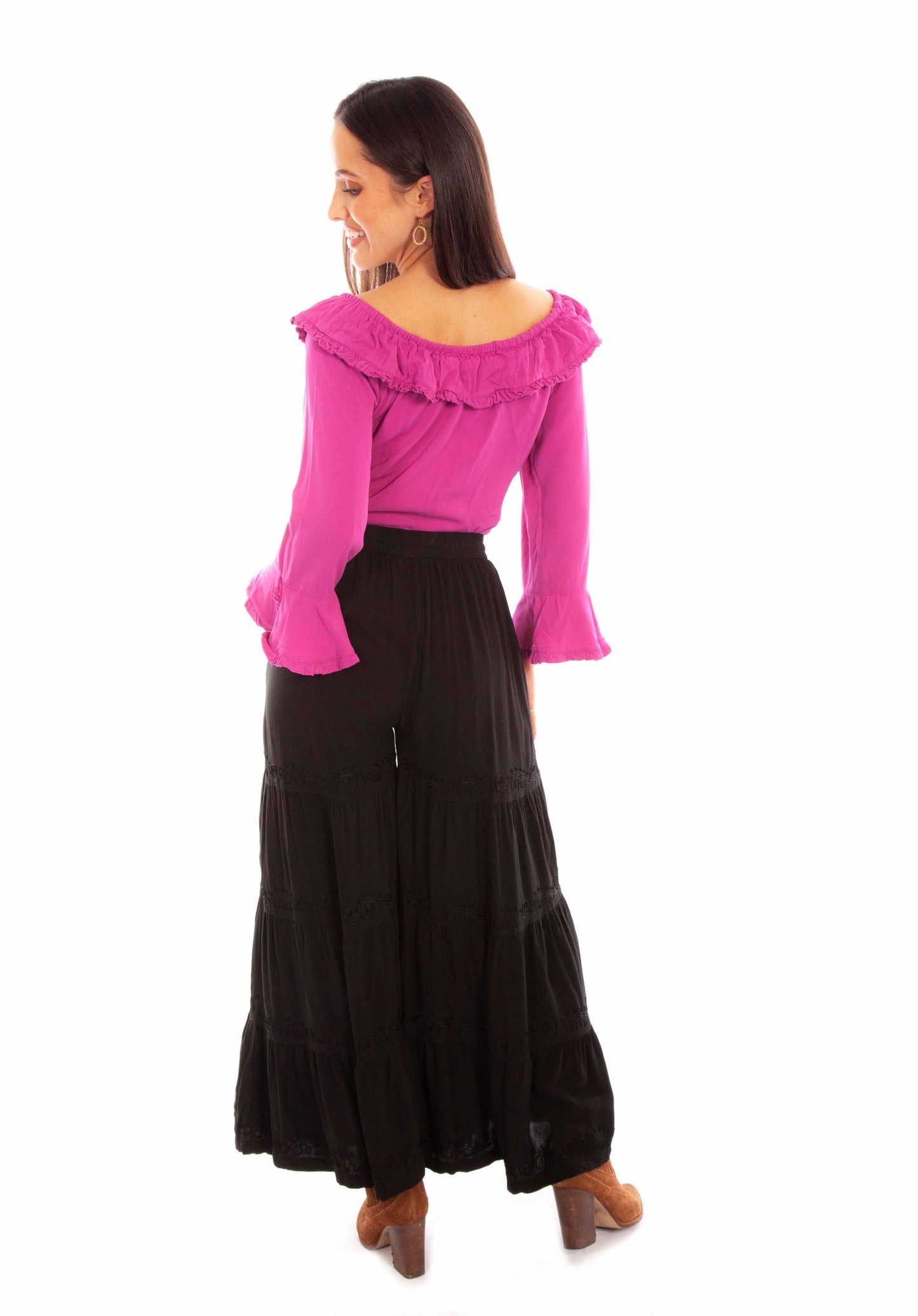 Woman in magenta top and black pants