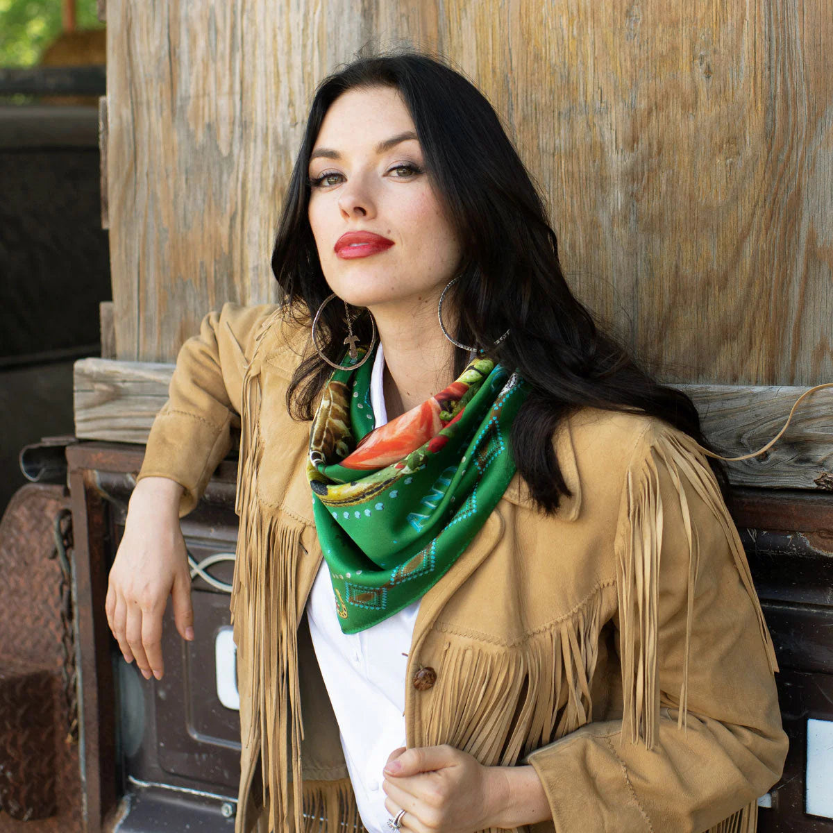 Woman in vintage western fringe jacket and green wild rag scarf
