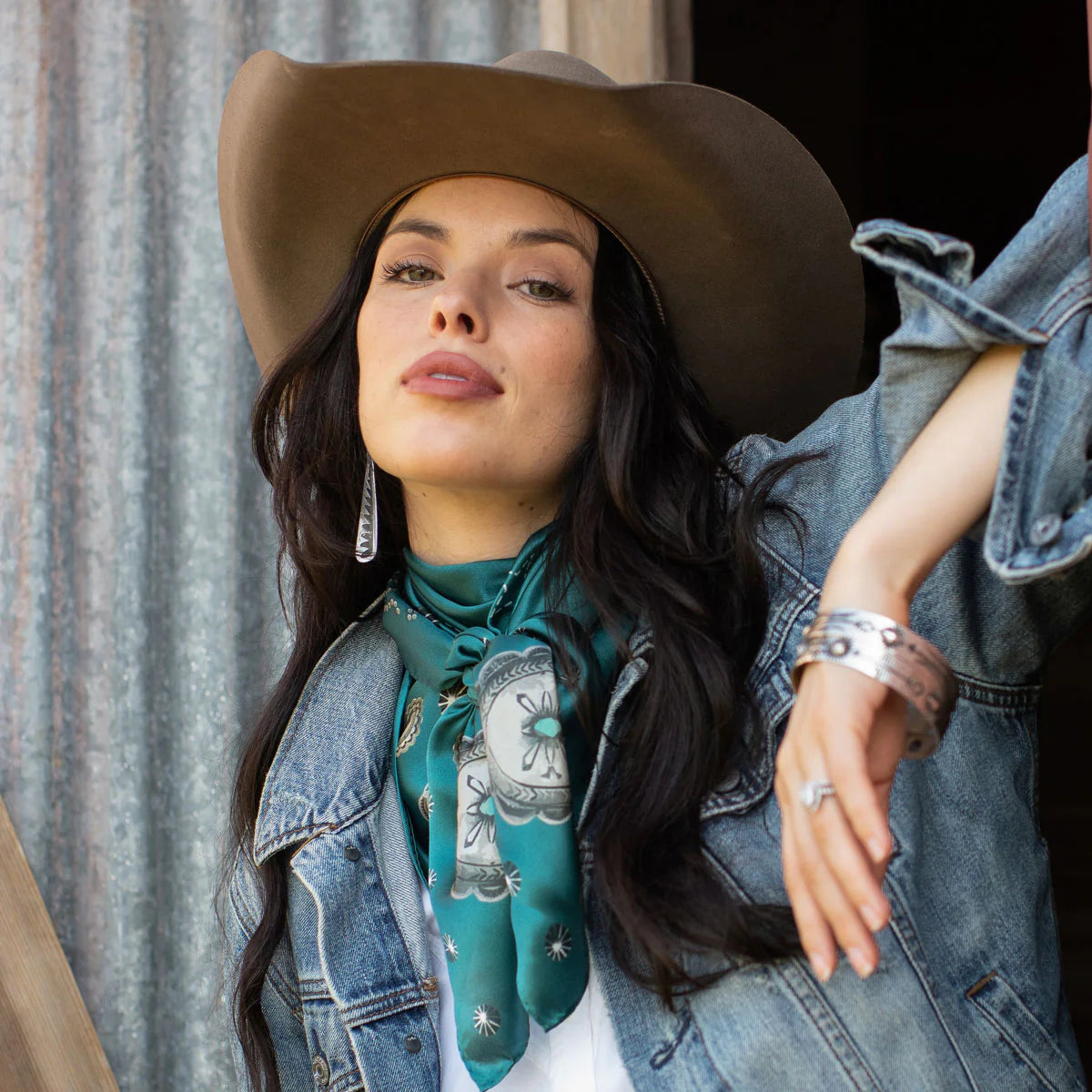 Woman wearing Howdy wild rag silk scarf and concho