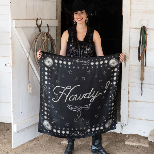 Woman holding black silk Howdy wild rag scarf