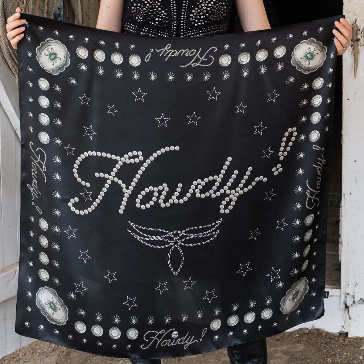 Black silk Howdy! wild rag scarf with concho details.