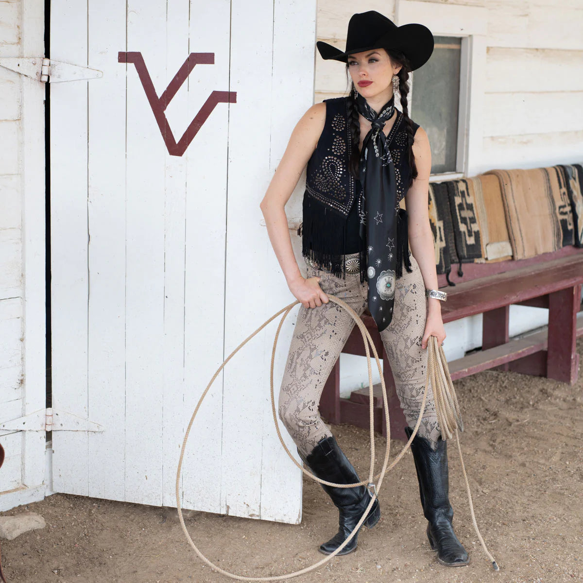 Cowgirl in black wild rag silk scarf and concho with rope
