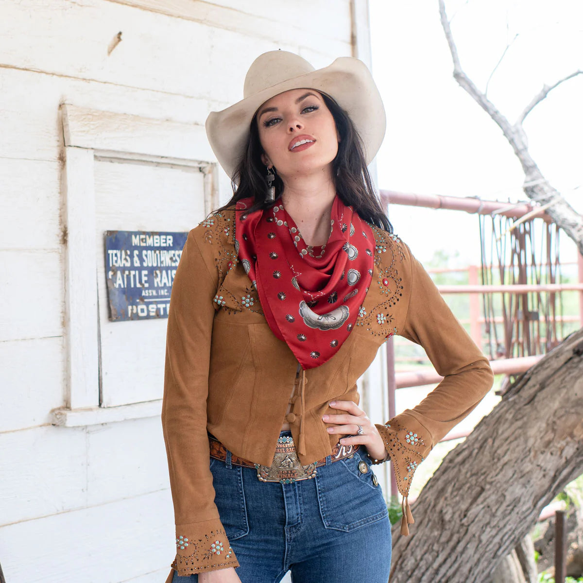 Cowgirl wearing red silk wild rag scarf and concho