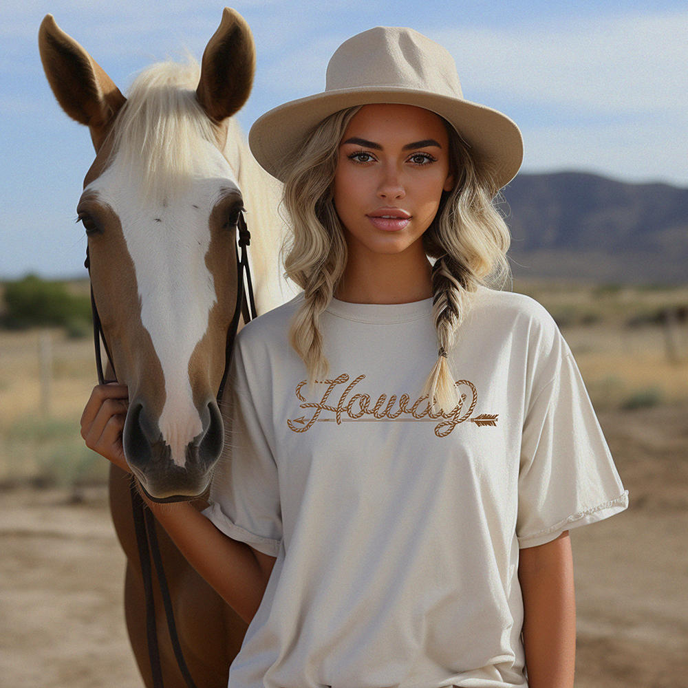 Woman with horse wearing Howdy tee and hat