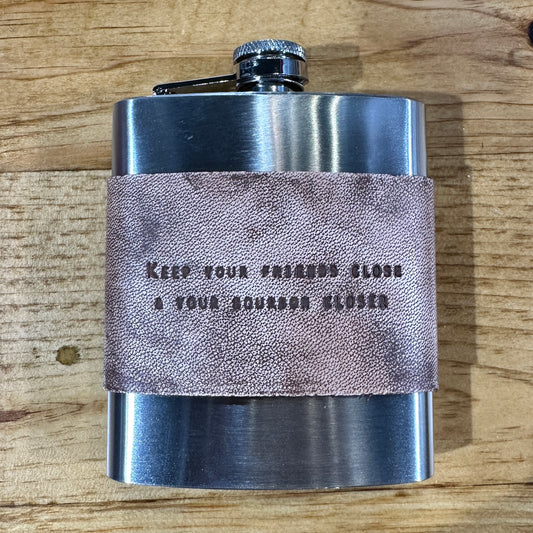 Stainless steel flask with leather band.
