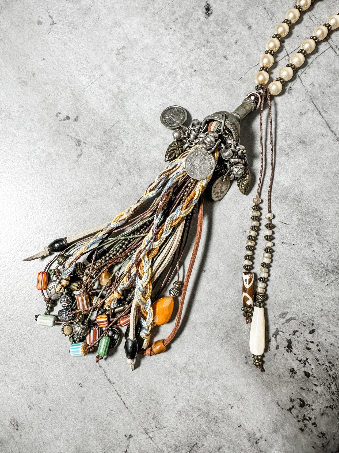 Boho style necklace with beads and tassels.